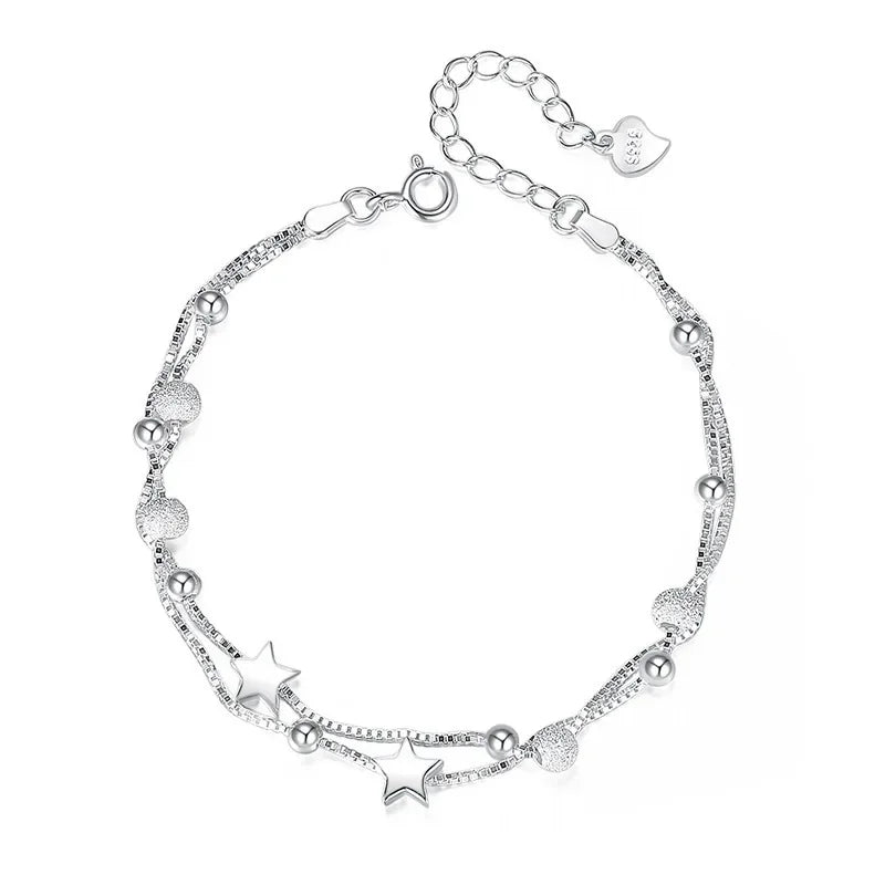 Pulseira prateada com detalhes de estrelas e esferas - Semijoias delicadas e elegantes